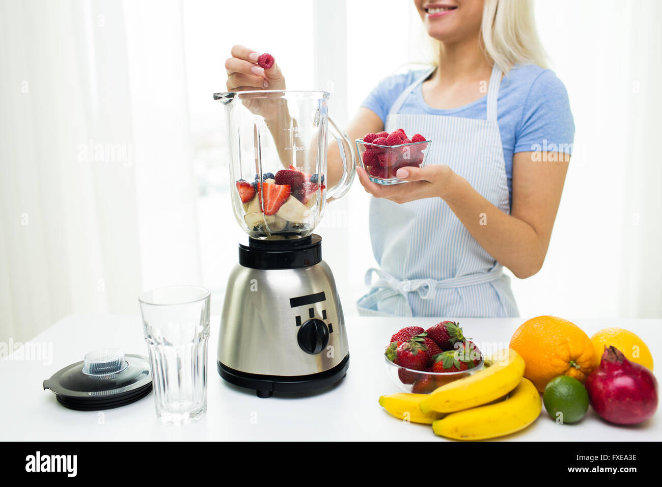 Premium Photo  Woman with hand blender making sweet banana