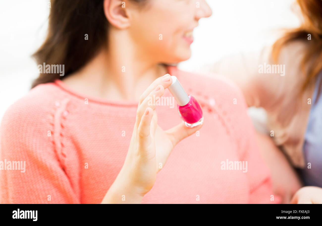 close up of smiling young woman with nail polish Stock Photo
