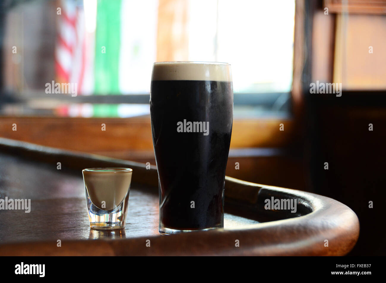 Drink known as a Irish Car Bomb guinness or stout with Bailey's on a