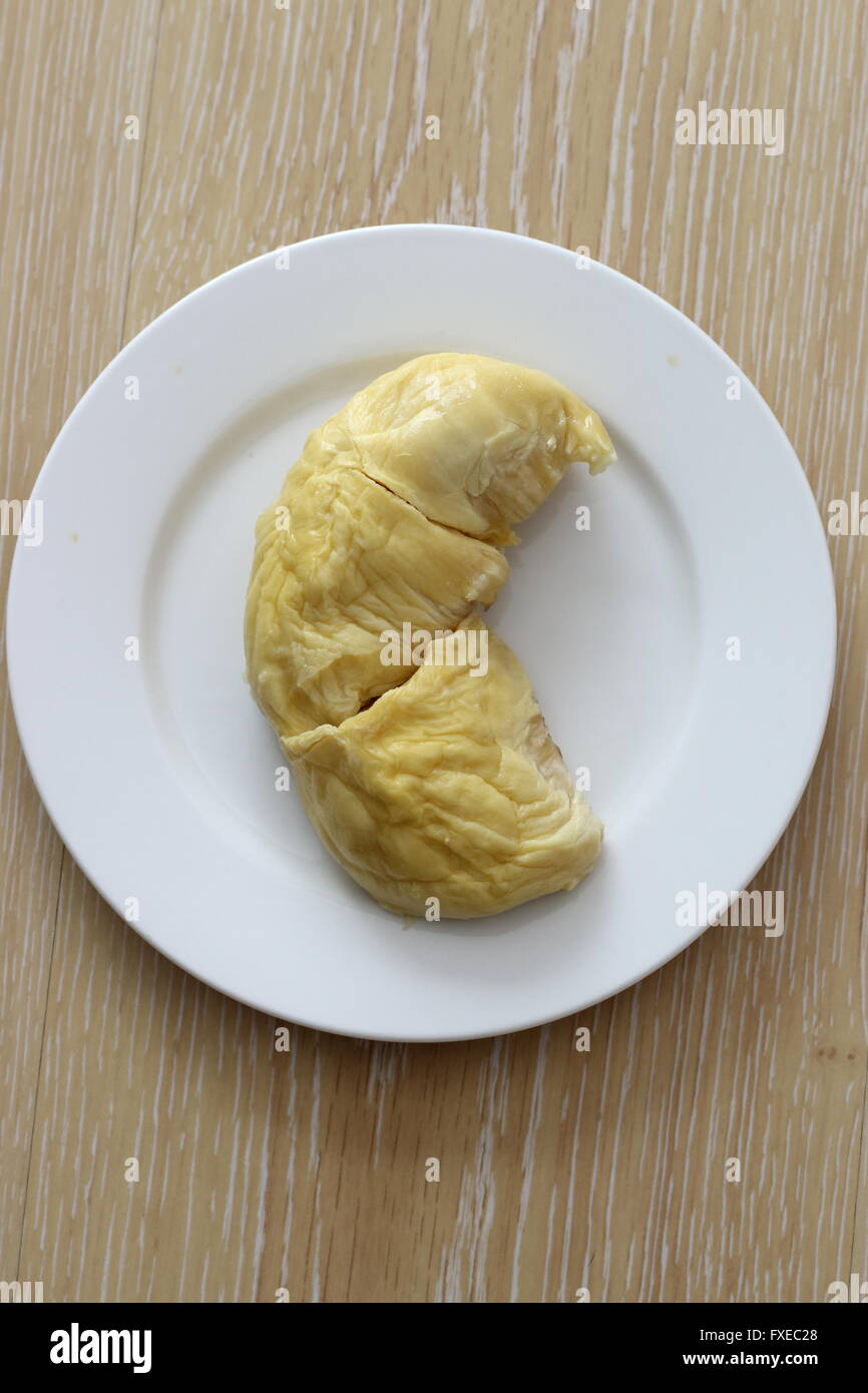 Durian flesh on white plate. Regarded by many people in southeast Asia as the 'king of fruits'. Stock Photo