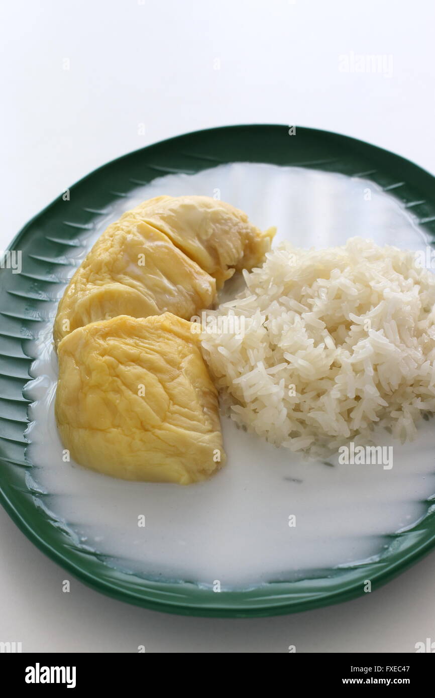 Close up image of Sweet  Glutinous Sticky Rice With Durian And Coconut Milk Sauce Stock Photo