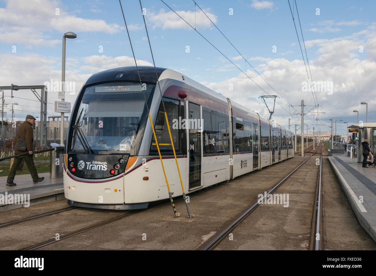 Tram boarding at Edinburgh Park tram stop, Edinburgh, Scotland, UK Stock Photo