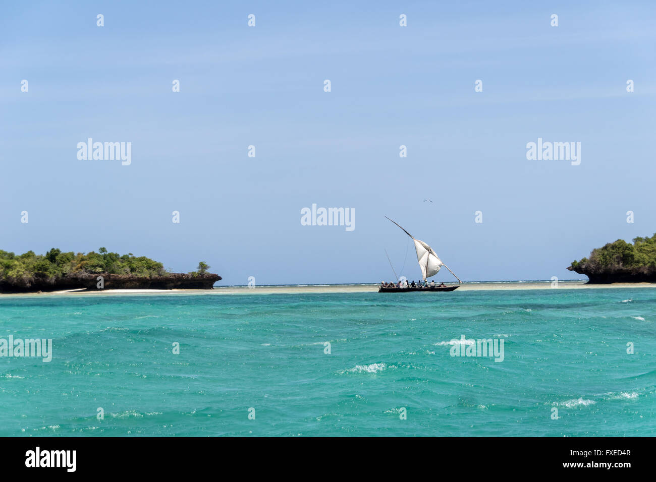 Local wooden boat sailing the Indian Ocean off the coast of Tanzania Stock Photo
