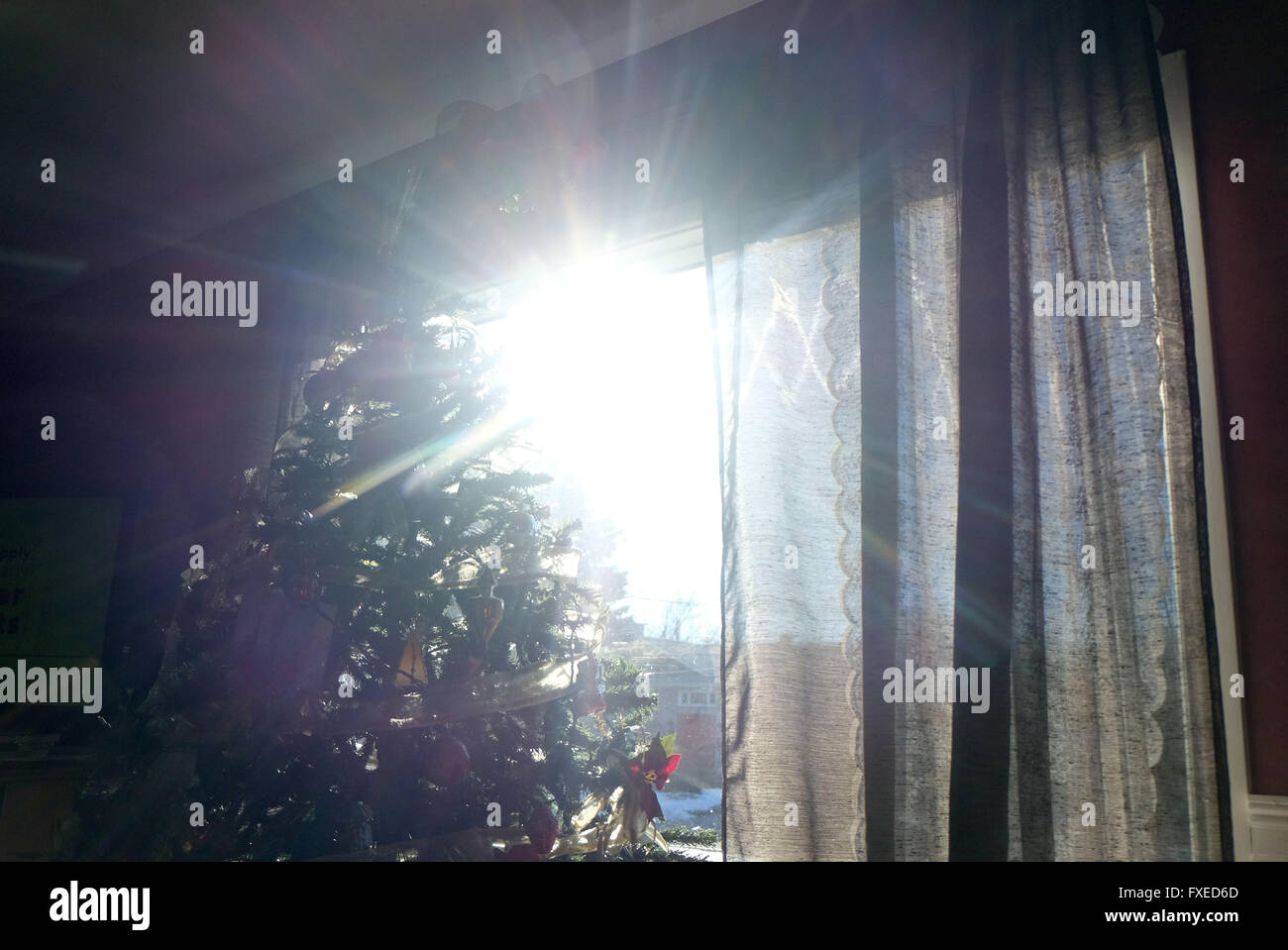 The winter sun shines through a window in a residentail home in Quebec in Canada. Stock Photo