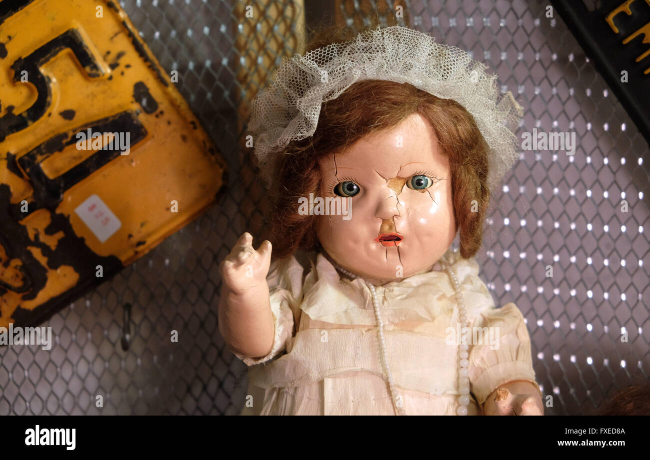 An antique doll at the indoor Brooklyn Flea market at Industry City in Brooklyn, New York, United States of America. Stock Photo