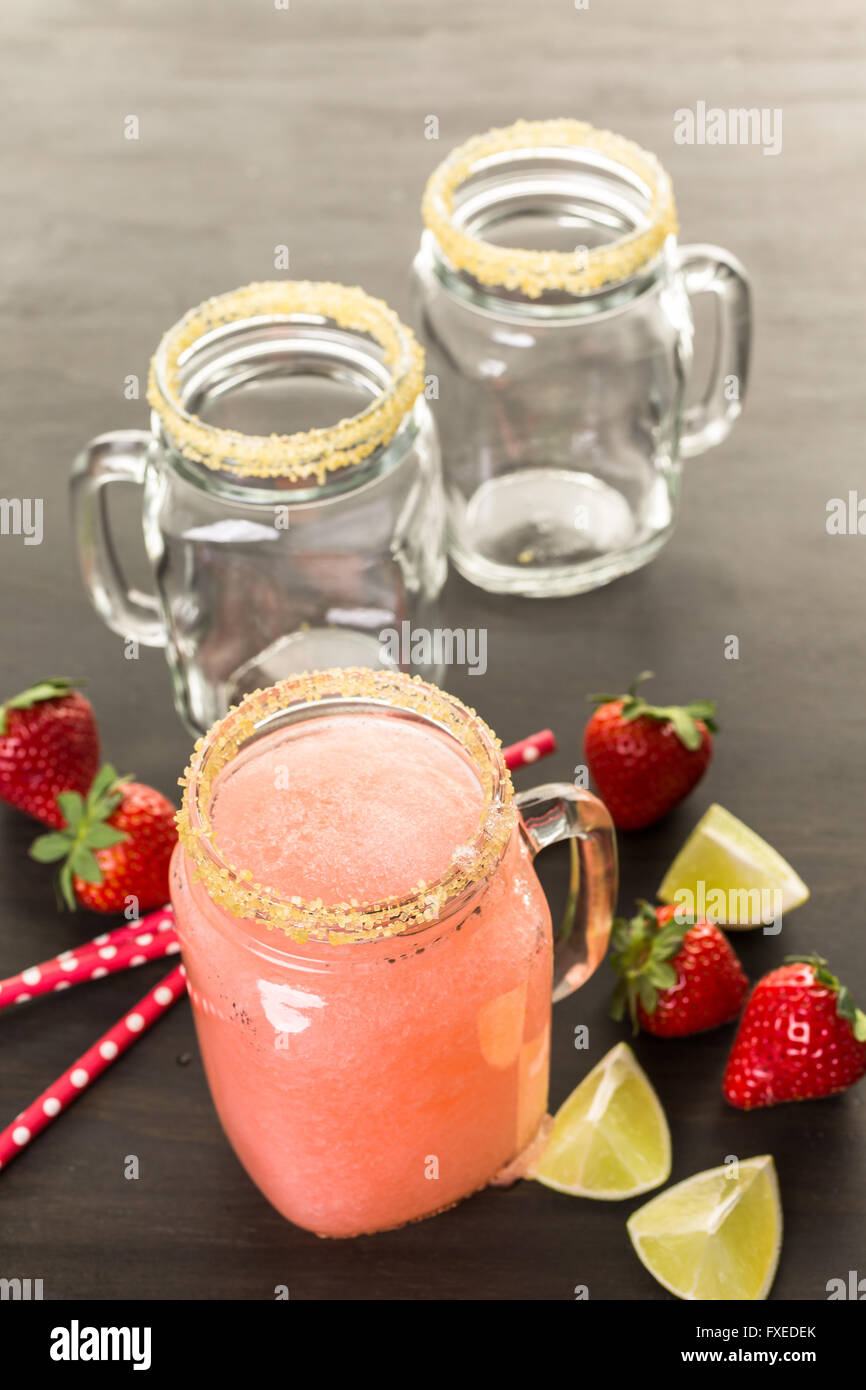 Frozen strawberry margarita cocktail in drinking mason jar Stock Photo