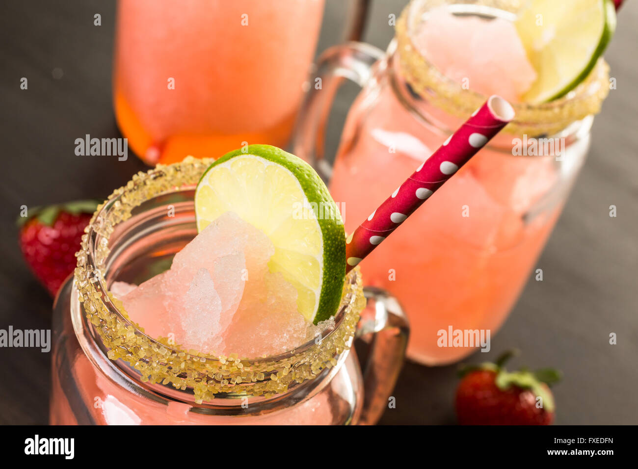Frozen strawberry margarita cocktail in drinking mason jar Stock Photo
