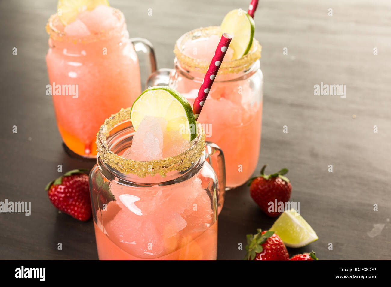 Frozen strawberry margarita cocktail in drinking mason jar Stock Photo