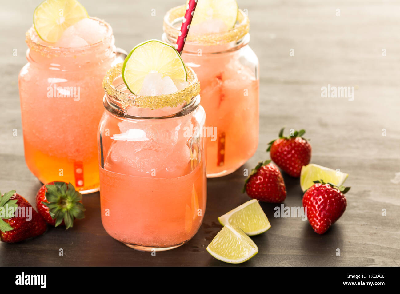 Frozen strawberry margarita cocktail in drinking mason jar Stock Photo
