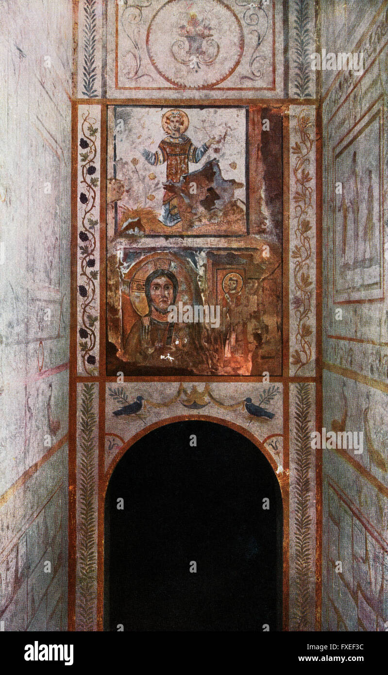 Fresco on the entrance to The Catacomb of Callixtus aka the Cemetery of Callixtus, Appian Way, Rome, Italy.  The lower fresco represents Christ and St. Urban. From Roma Sacra, published 1925. Stock Photo