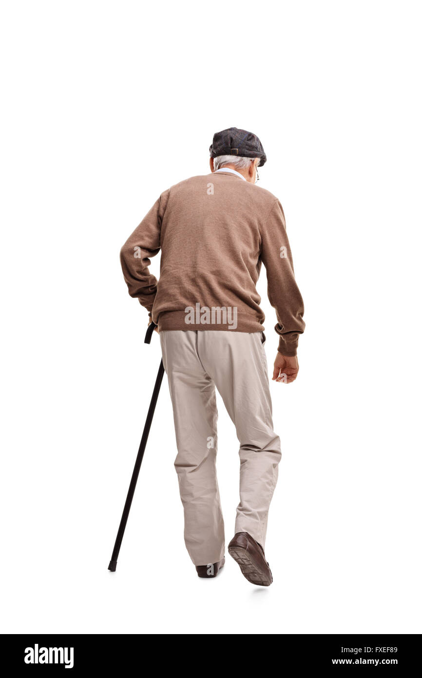 Rear view vertical shot of an old man walking with a black cane isolated on white background Stock Photo