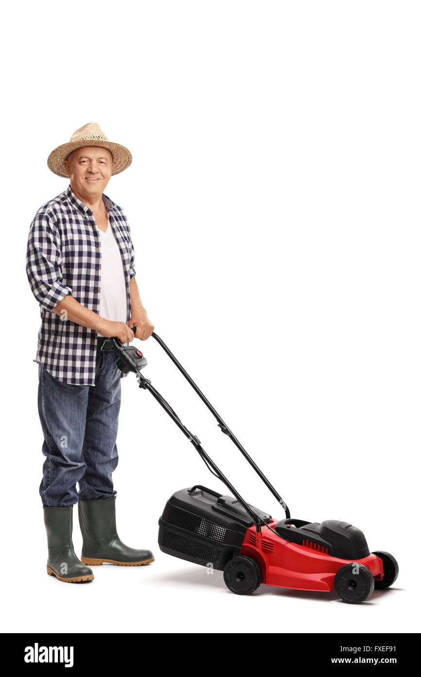 Vertical shot of a mature man posing with a red lawn mower isolated on white background Stock Photo