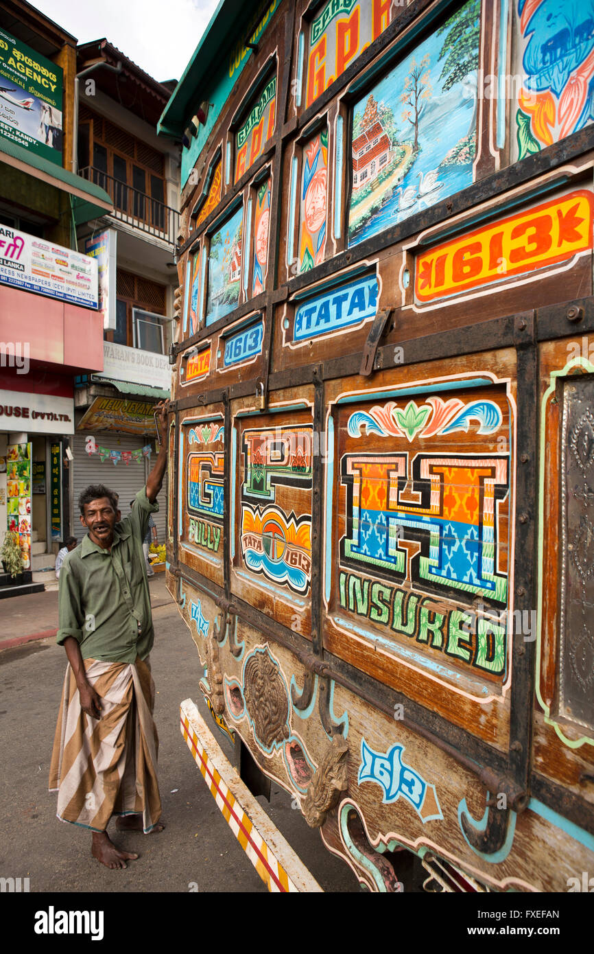 Sri Lanka, Kandy, Colombo Street, man in lunghi with decorated truck rear panel Stock Photo
