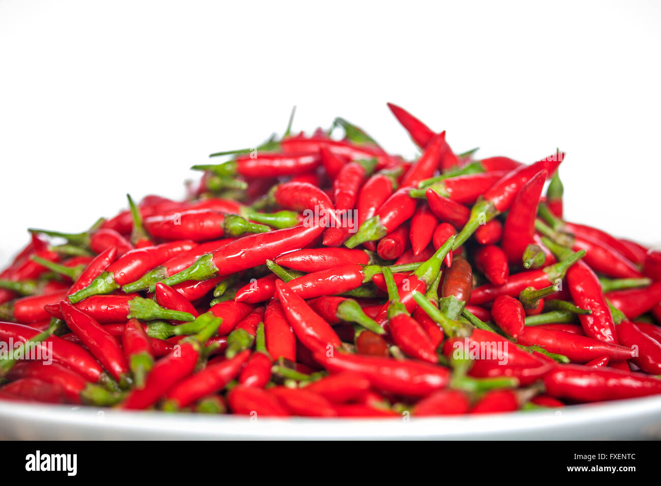 Plate of Thai red chilies on white background Stock Photo