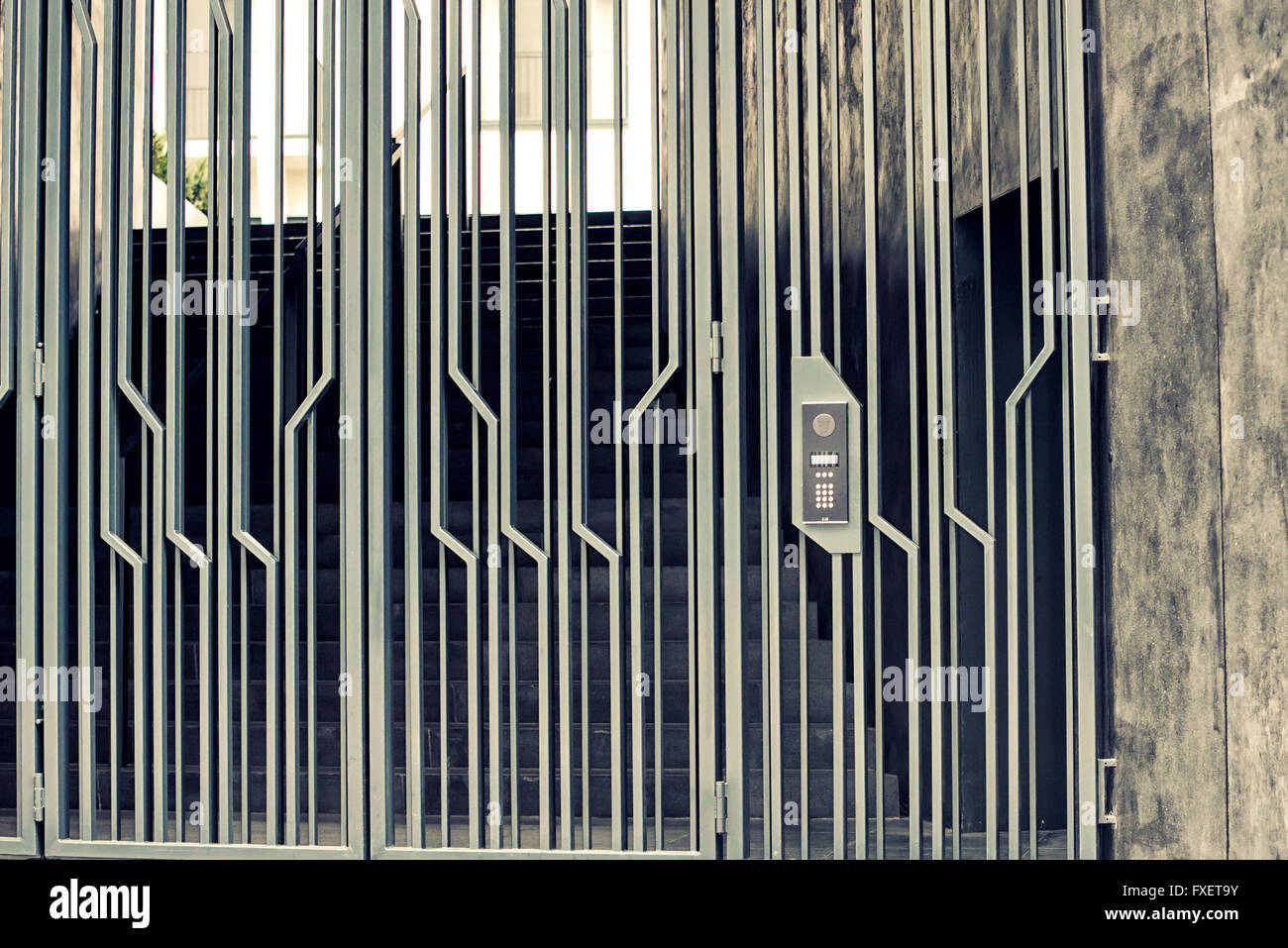 Close-up of building intercom and gate Stock Photo - Alamy