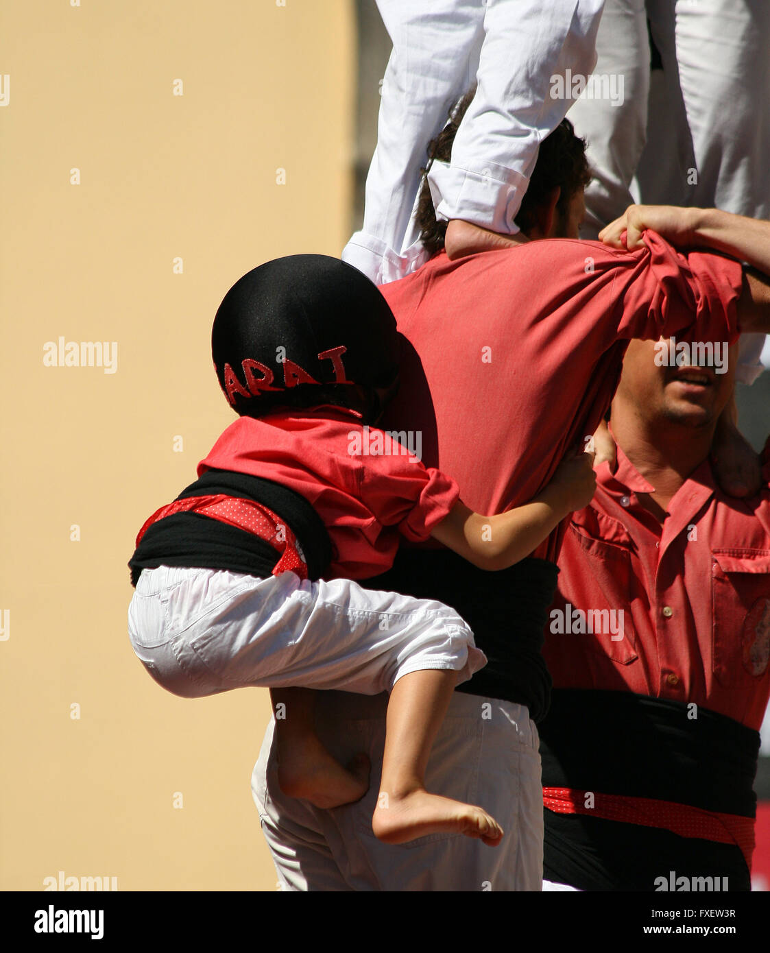 People making human towers, a traditional spectacle in Catalonia called ...
