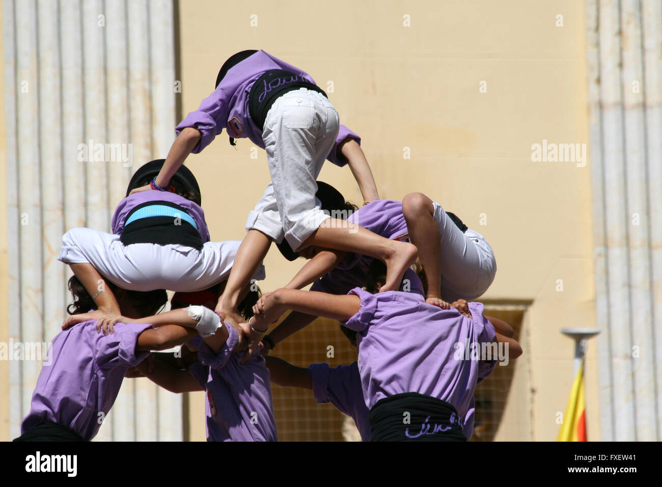 People making human towers, a traditional spectacle in Catalonia called ...