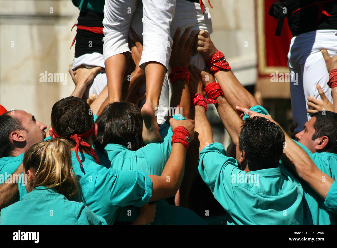 People making human towers, a traditional spectacle in Catalonia called ...