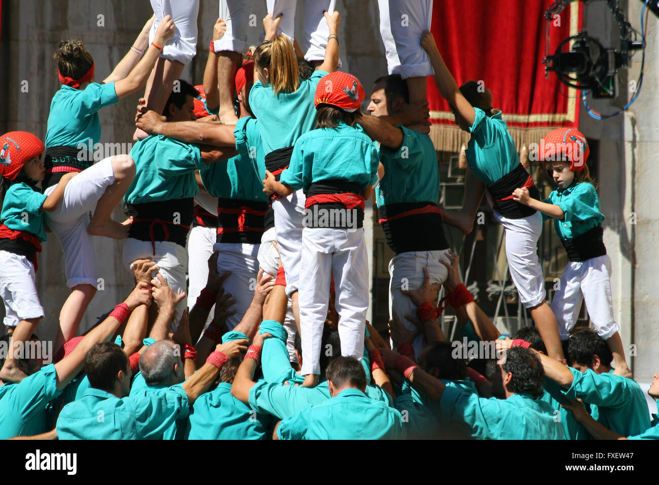 People making human towers, a traditional spectacle in Catalonia called ...