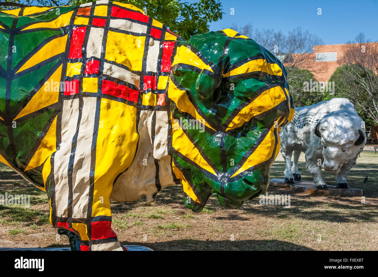 'Frankie' and 'Amadeus' public art painted buffalo sculptures in downtown Bartlesville, Oklahoma, USA. Stock Photo