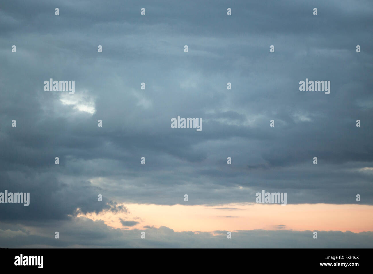 Stormy gray blue cloudy sky with clouds color photo Stock Photo - Alamy