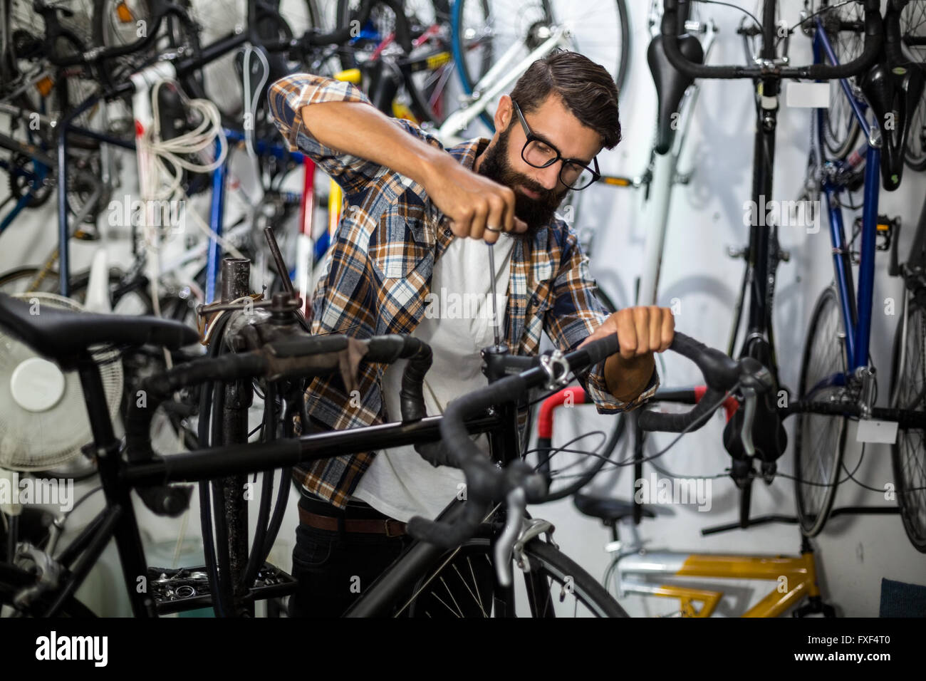 Bike mechanic checking at bicycle Stock Photo Alamy