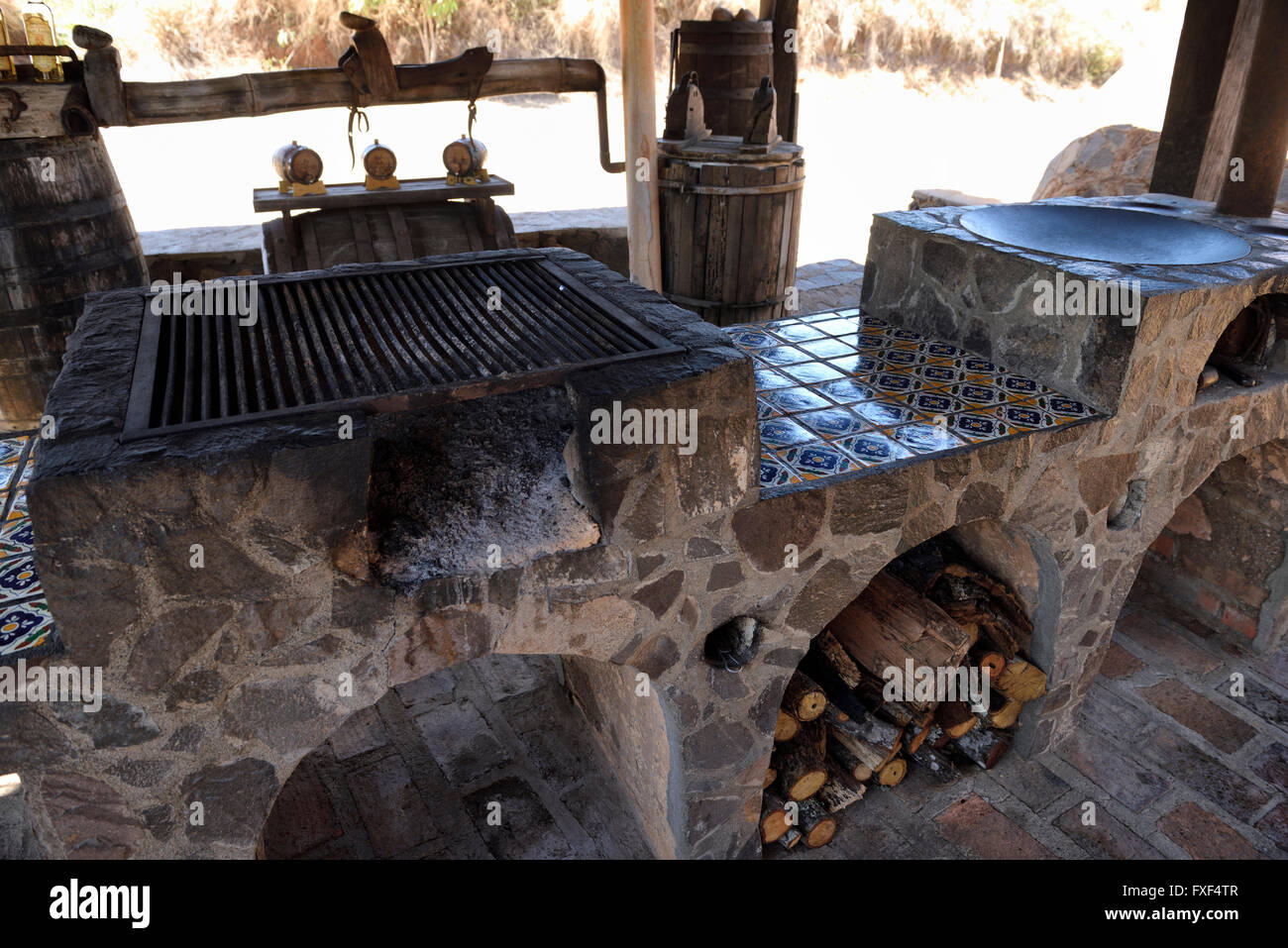 Outdoor kitchen with fireplace and grill for producing flavoured tequilas alcoholic beverage in Jalisco Mexico Stock Photo