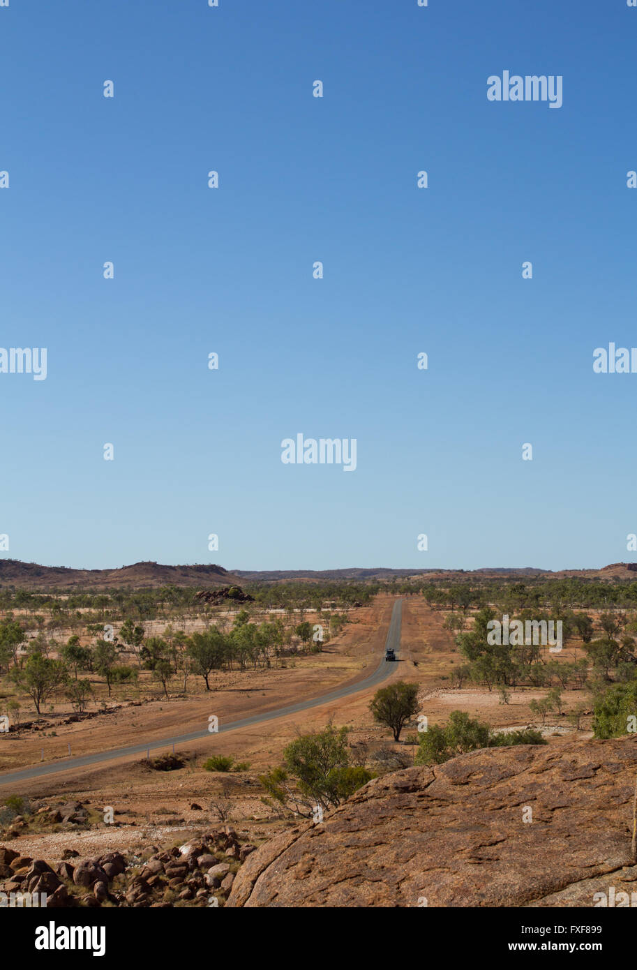 Lonely Car on a long Highway trough the Australian Outback. MT ISA