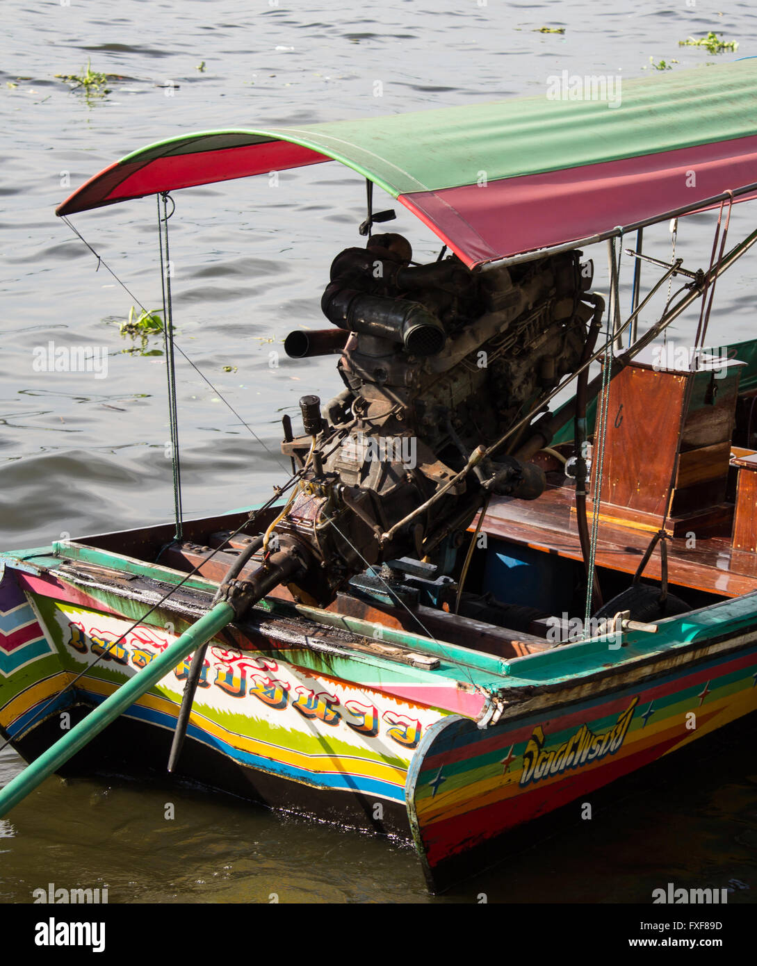 Big outboard diesel engine on a small tourist transportation boat in Bangkok, Thailand, Asia. Stock Photo