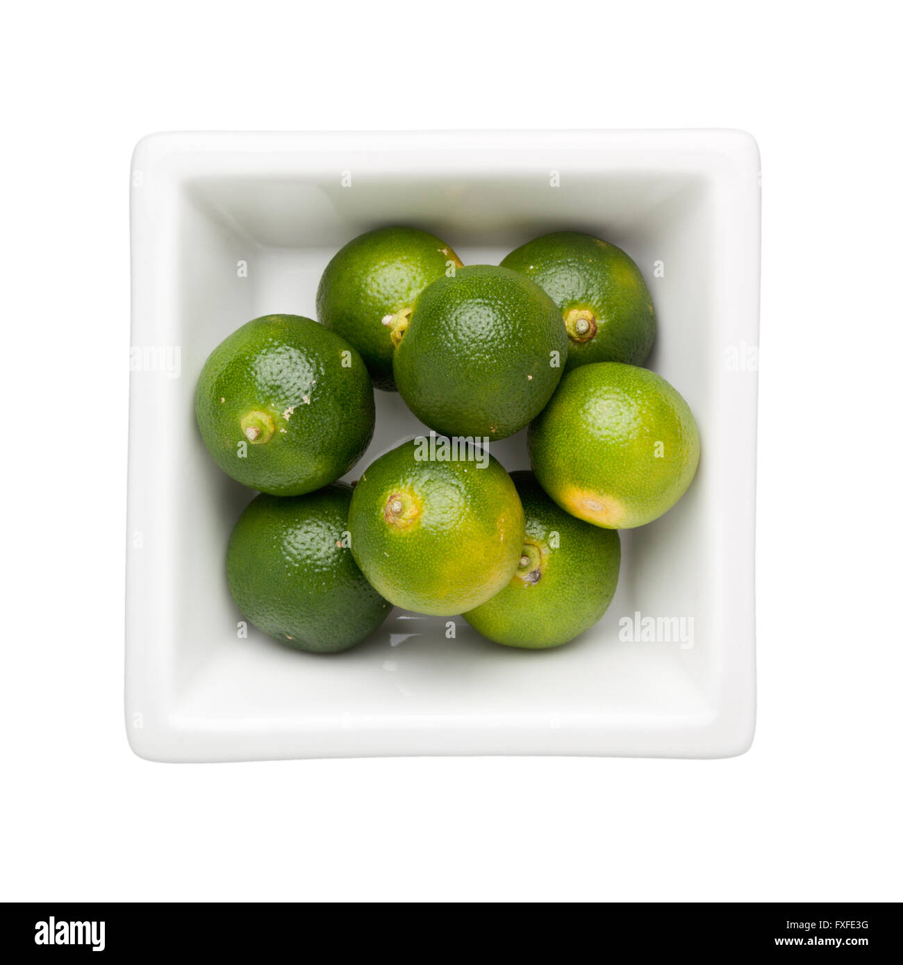 Calamondin fruits in a square bowl isolated on white background Stock Photo