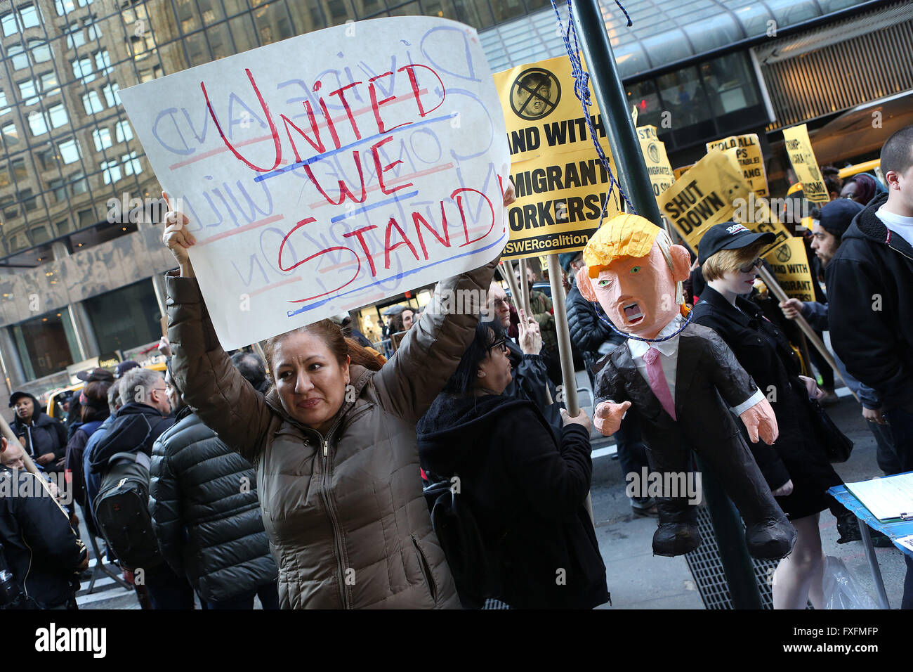 New York City, NY, USA. 14th Apr, 2016. A woman poses with a Donald Trump pi''“ata hanging from a noose. Hundreds of demonstrators protested Republican presidential candidate Donald Trump near Grand Hyatt New York on 42nd Street and Lexington Avenue. Donald Trump was set to speak at the hotel for the NY State Republican Gala, a fundraiser hosting all three Republican candidates that costs $1,000 a plate. Groups including the Muslim Democratic Club of New York, United We Dream Action, and Make the Road helped organize the protests. Credit:  ZUMA Press, Inc./Alamy Live News Stock Photo