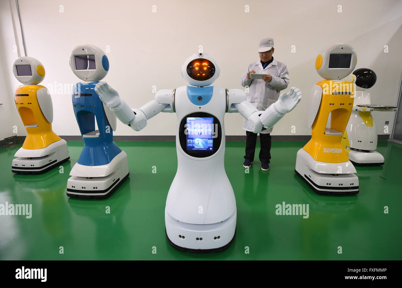 Shenyang, China's GDP stood at 15.9 trillion RMB yuan (2.4 trillion USA dollars) in the first quarter this year, growing up by 6.7 percent year on year. 15th Apr, 2016. A worker tests robots before putting them into the market at a factory of Siasun Robot and Automation Co., Ltd. in Shenyang, capital of northeast China's Liaoning Province, April 12, 2016. China's GDP stood at 15.9 trillion RMB yuan (2.4 trillion U.S. dollars) in the first quarter this year, growing up by 6.7 percent year on year, the National Bureau of Statistics said on April 15, 2016. © Pan Yulong/Xinhua/Alamy Live News Stock Photo
