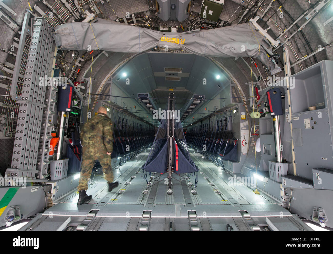 Wunstorf, Germany. 15th Apr, 2016. A soldier walks up the ramp of an ...