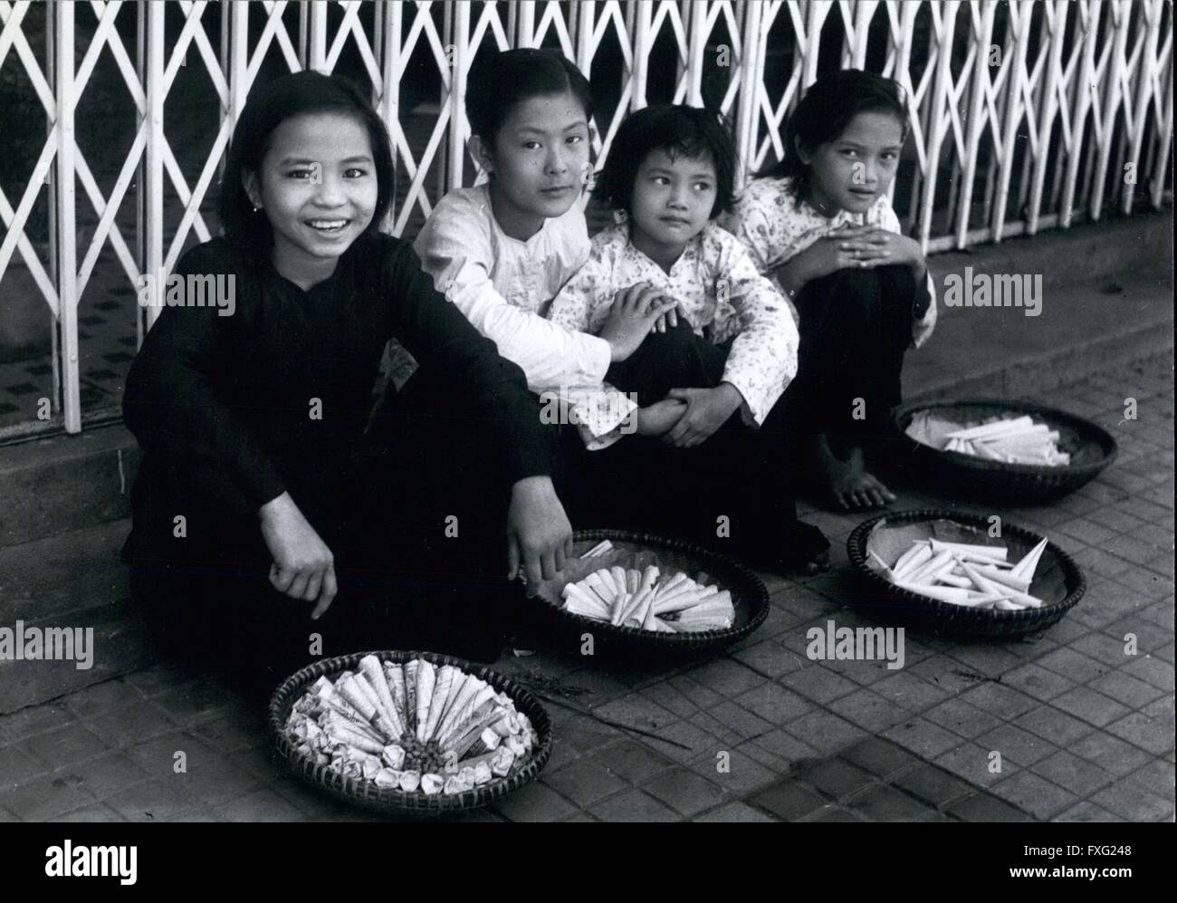 1956 - Girl peanut sellers of Saigon, roam the streets all day, and past midnight selling little cones of nuts to passers by. © Keystone Pictures USA/ZUMAPRESS.com/Alamy Live News Stock Photo