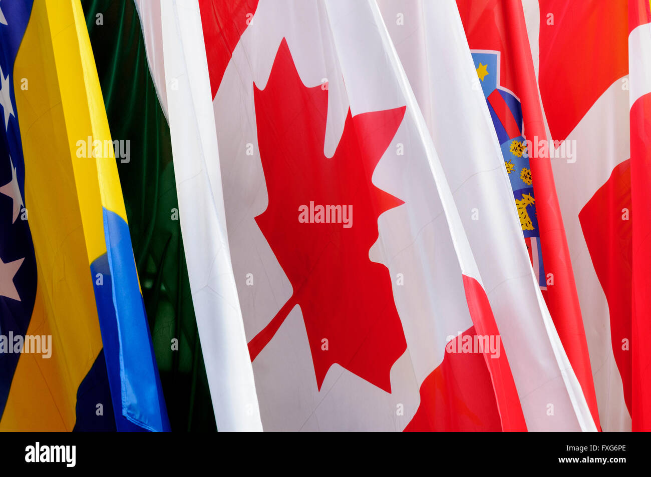 Canadian flag surrounded by a set of other national flags Stock Photo