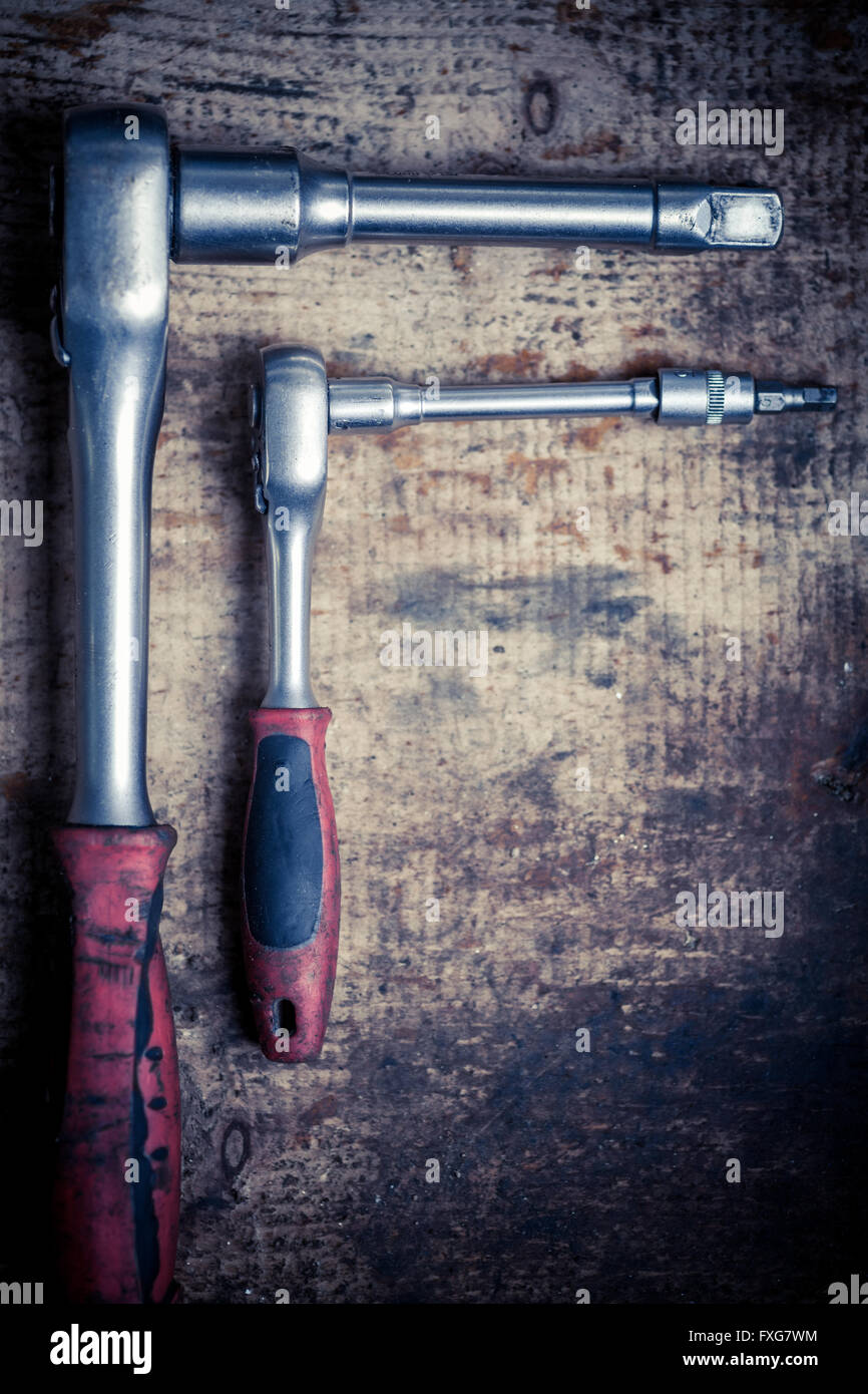 Color image of two socket spanners on a wooden plank Stock Photo - Alamy