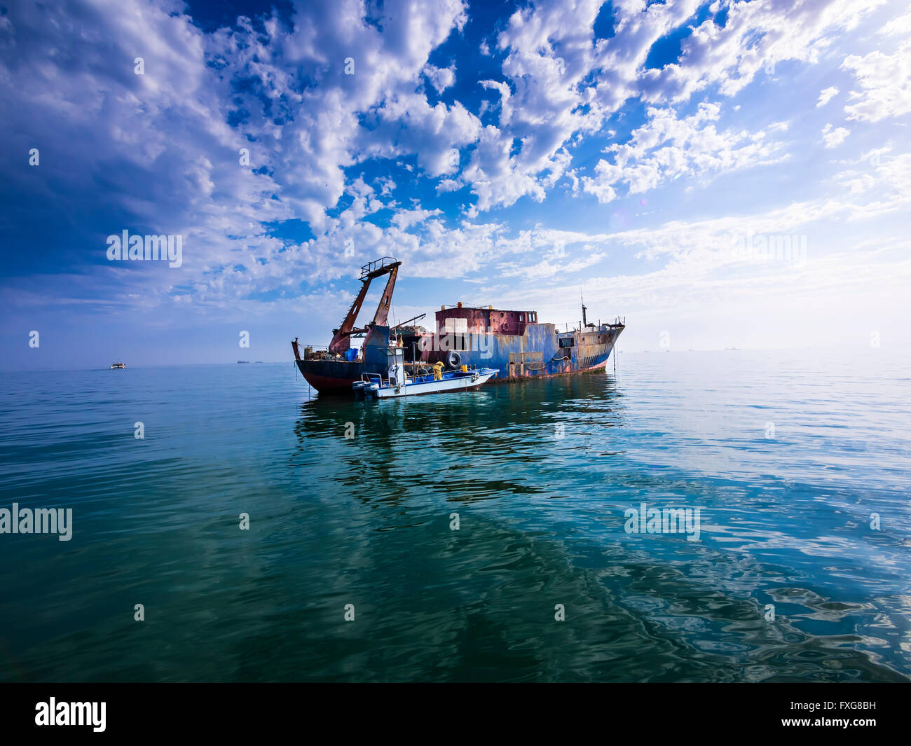 Oystercatchers, old rusty oyster fishing boat at oyster bed, Walvis Bay, Erongo Region, Namibia Stock Photo