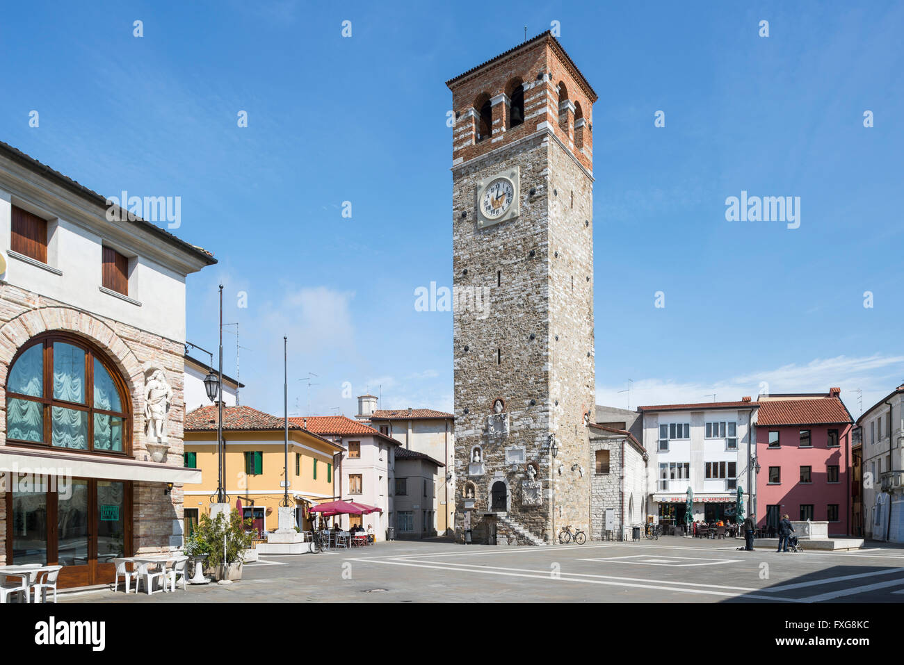 Town square with clock tower, Piazza Vittorio Emanuele, Marano Lagunare, Udine, Friuli-Venezia Giulia, Italy Stock Photo