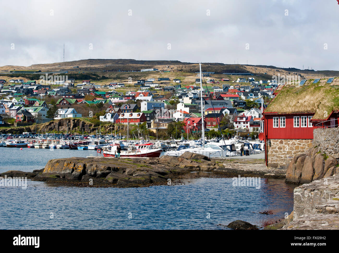 Colorful houses and small boats in the harbor, Tinganes, Tórshavn, Tórshavn, Faroe Islands, Føroyar, Denmark Stock Photo