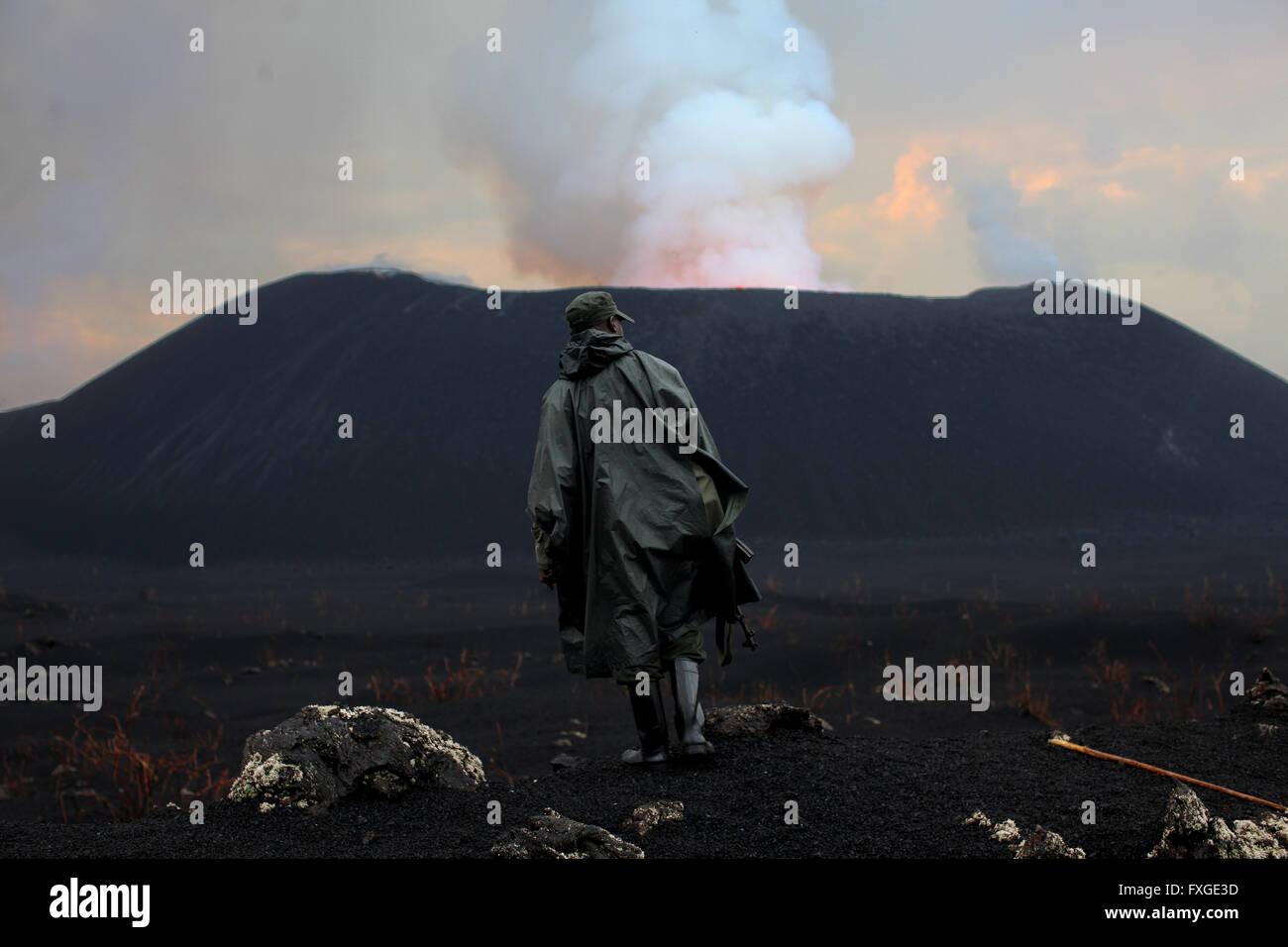 Rangers of the Virunga National Park in the Democratic Republic of Congo lead a tour to the newly erupting Nyamulagira  Volcano. Stock Photo