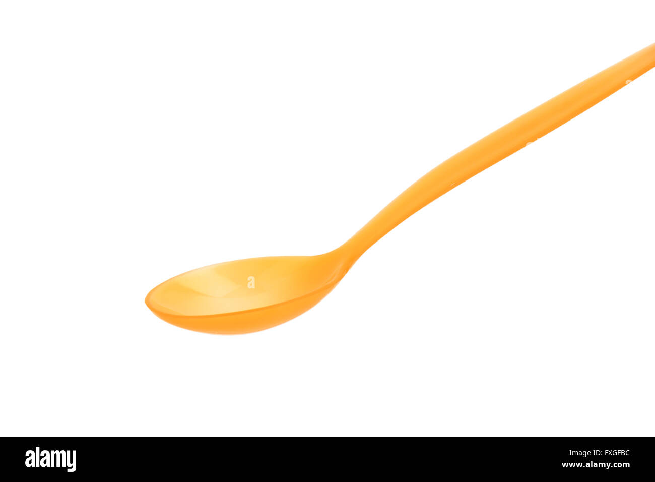 Orange plastic spoon on white background Stock Photo