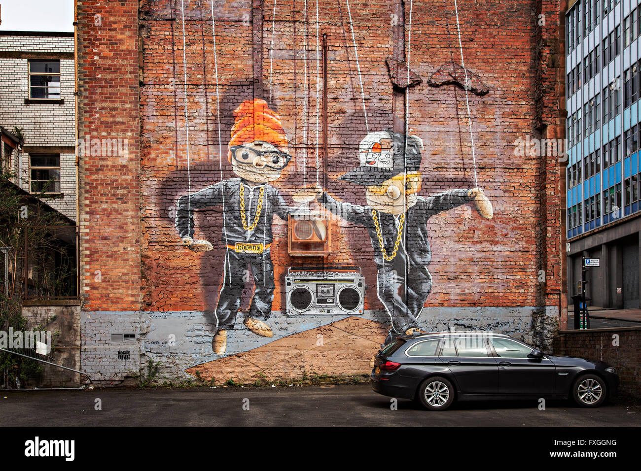GLASGOW APRIL 02, 2016; Wall mural by artist Rogue One called 'Hip Hop Marionettes'. Glasgow, Scotland. Stock Photo