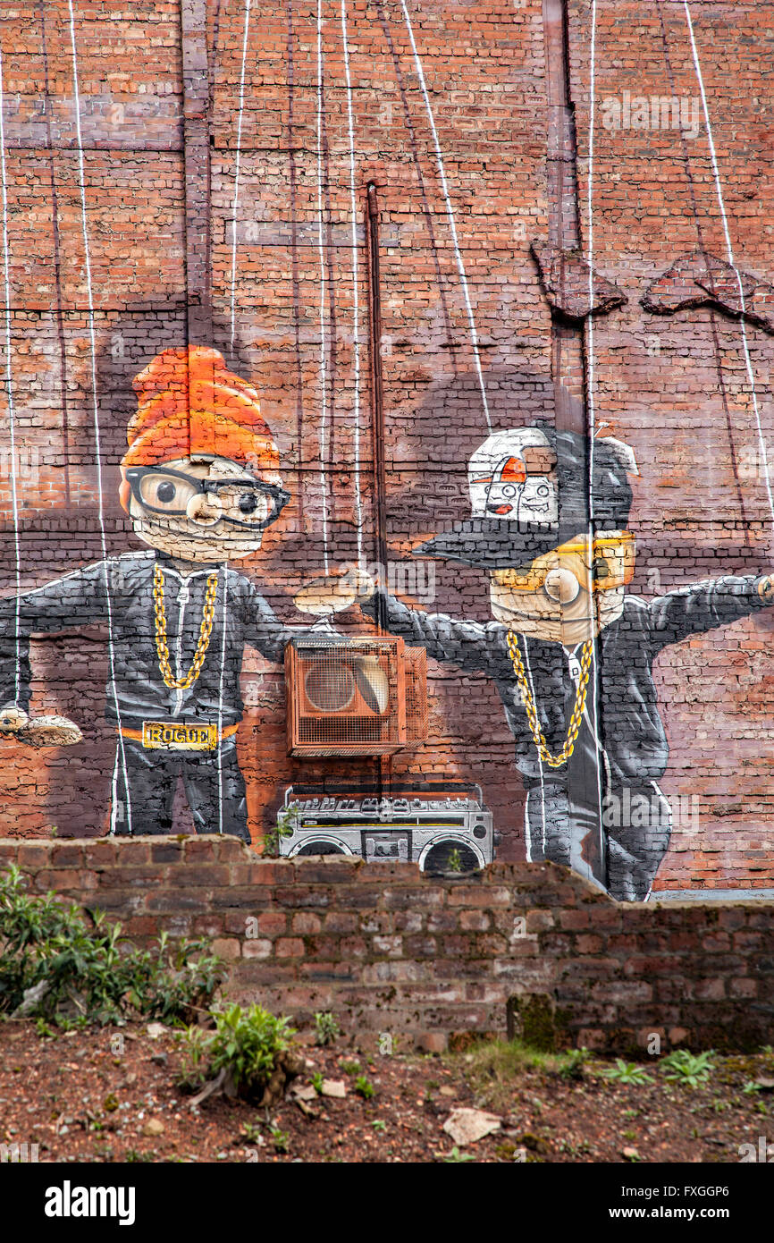 GLASGOW APRIL 02, 2016; Wall mural by artist Rogue One called 'Hip Hop Marionettes'. Glasgow, Scotland. Stock Photo