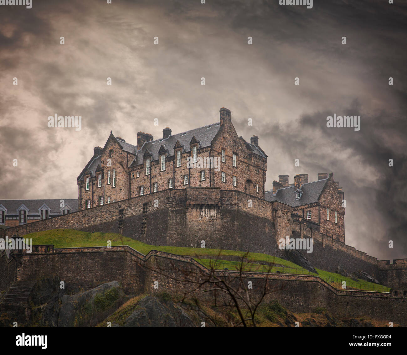 Image of the Edinburgh rock and its medieval castle. Some noise. Stock Photo