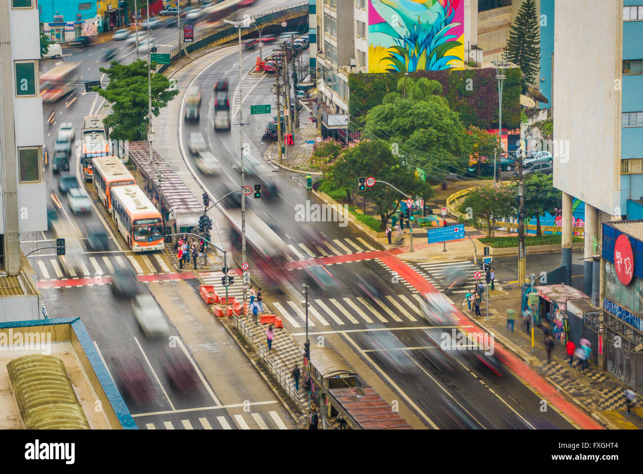 Intense traffic in the Consolacao avenue, Sao Paulo, Brazil. While some vehicles move fast, others are still. Stock Photo