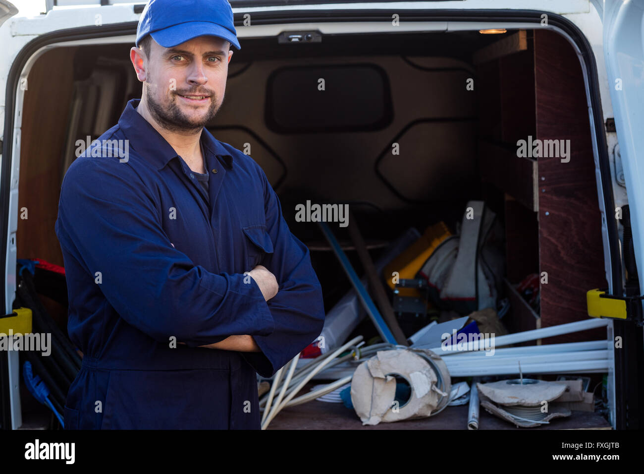 Portrait of handyman standing with arms crossed Stock Photo