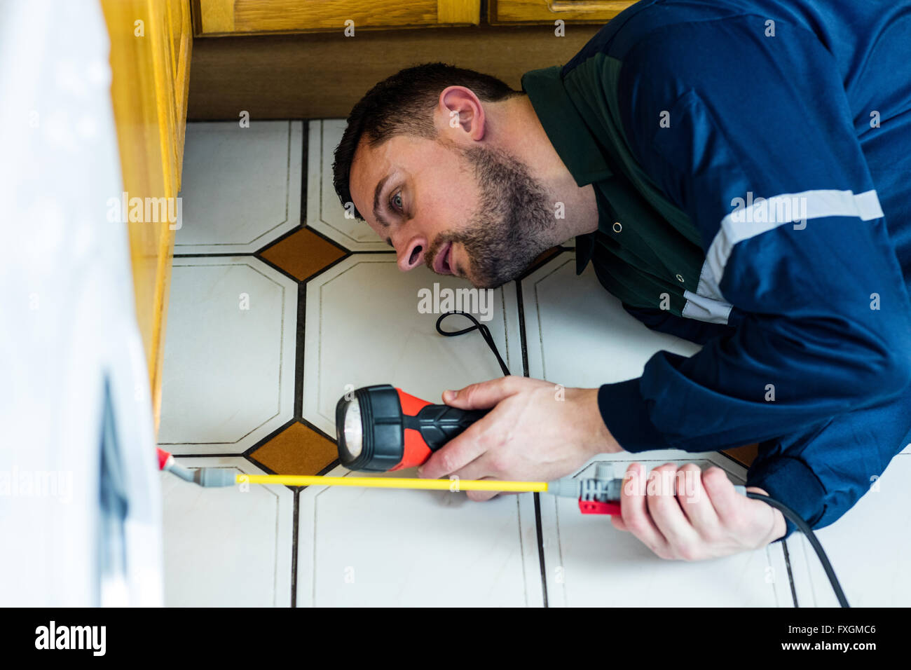 Pest control man spraying pesticide Stock Photo