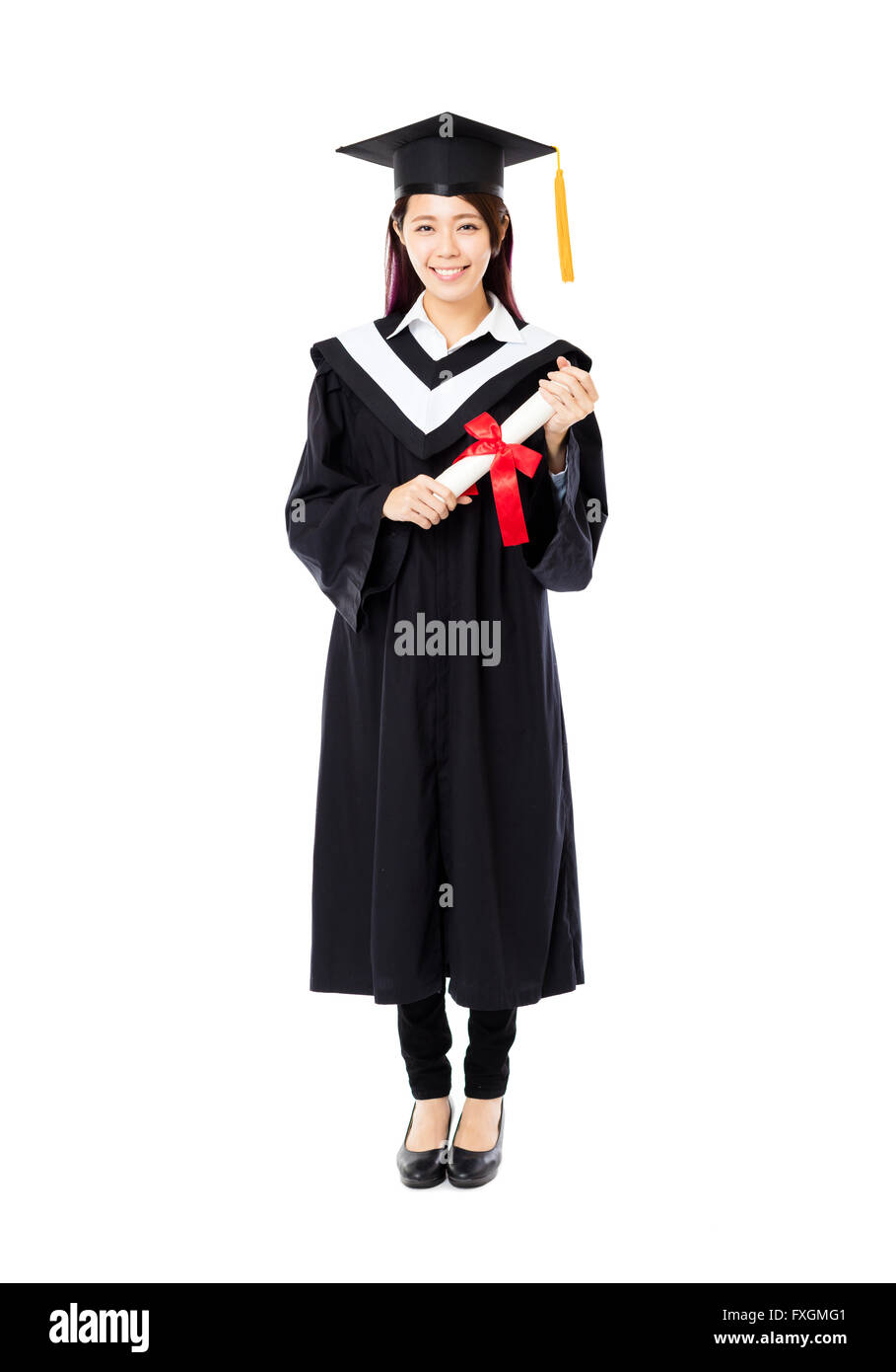 full length of  young female college graduation Stock Photo