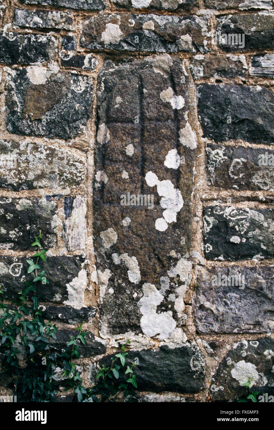 One of five Early Christian graveslabs built into the wall of St Gwyndaf's Church, Llanwnda, Pembrokeshire. Stock Photo