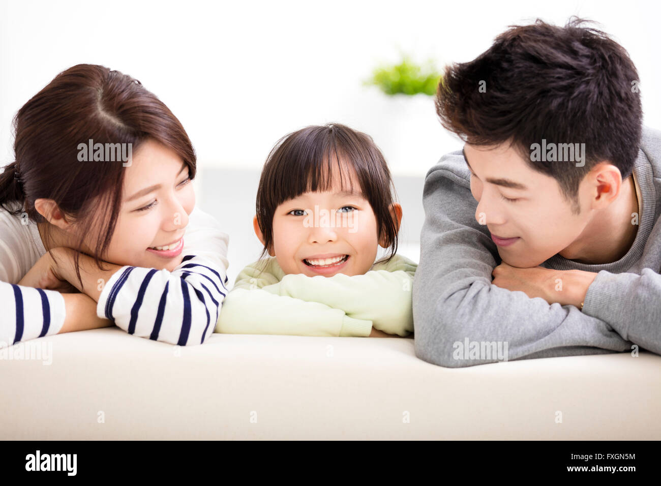 Happy Attractive Young  Family and little girl Stock Photo